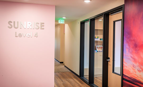 A sign that reads 'Sunrise: Level 4' inside Restoring Waters